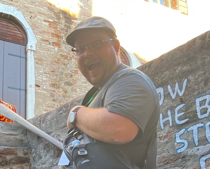 artwork of paper hands of various colors with the words "Everyone is Welcome Here, Everyone Belongs"