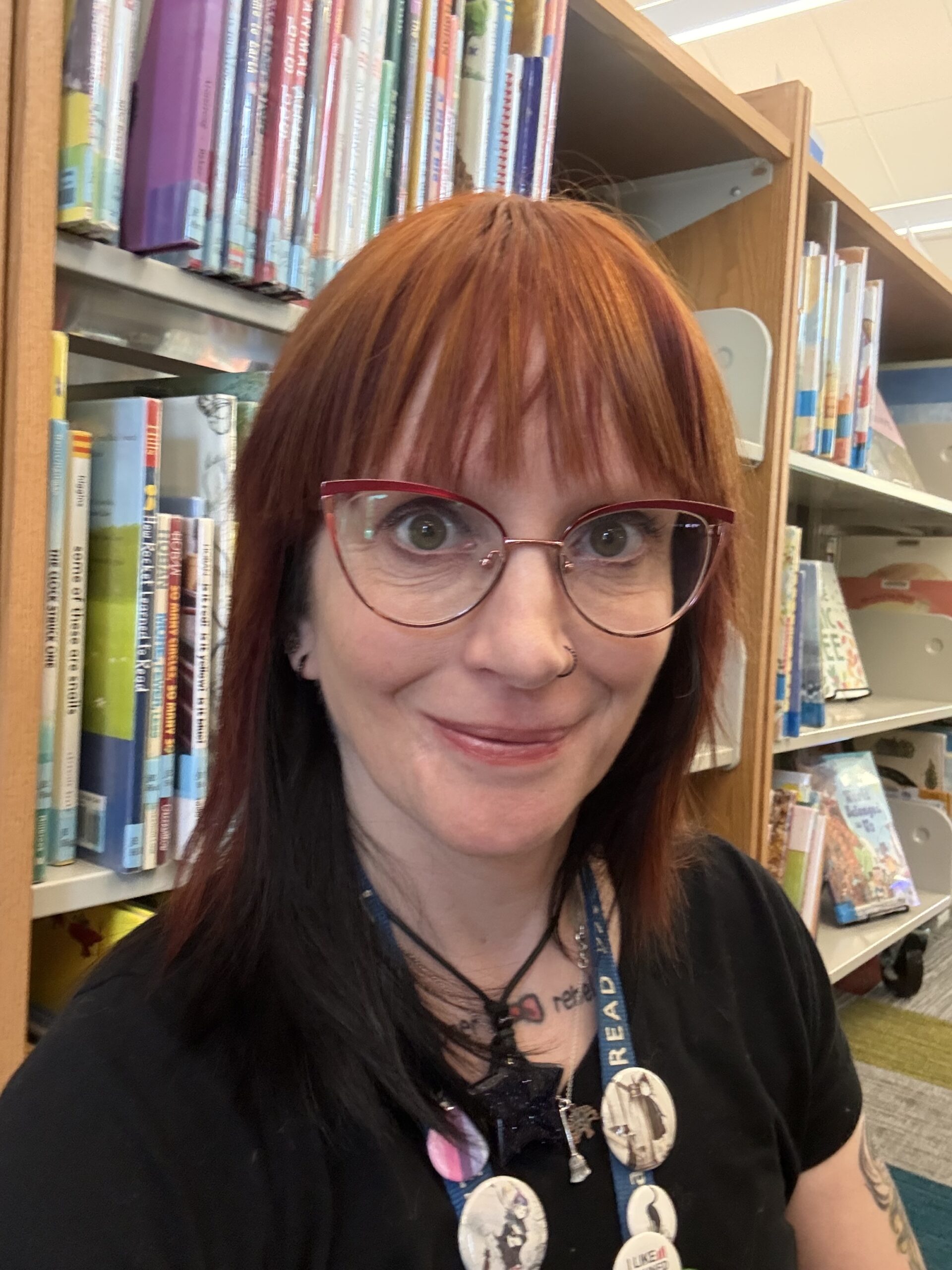 artwork of paper hands of various colors with the words "Everyone is Welcome Here, Everyone Belongs"