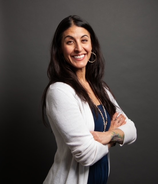 Headshot of Kelly Ann Sassonne.